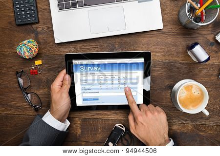 Businessman Filling Online Survey Form
