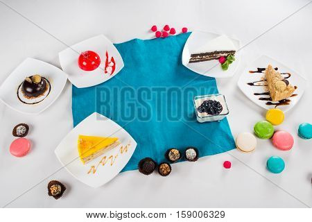 Delicious desserts and cheesecake makarons in the decor