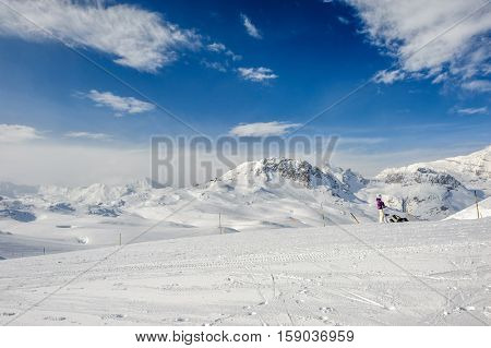 Alpine winter mountain landscape. French Alps covered with snow in sunny day. Val-d'Isere, France