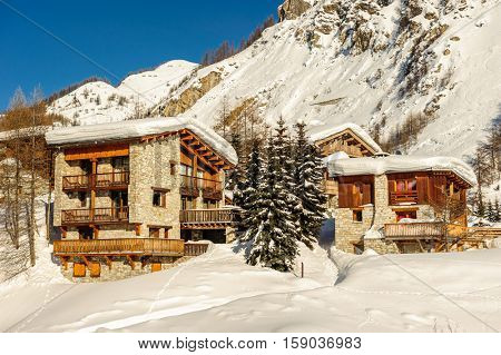Alpine winter mountain landscape. French Alps covered with snow in sunny day. Val-d'Isere, France