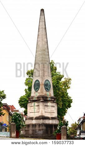 LUDWIGSBURG, GERMANY-JUNE 18, 2015: Obelisk Memorial (by Donato Giuseppe Frisoni) for the four great sons of the city at the Holzmarkt in baroque historic city of Ludwigsburg