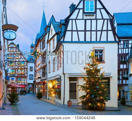Old street  decorated for Christmas in the historic center of Bernkastel-Kues, Rhineland-Palatinate, Germany. Toned image