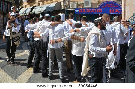 JERUSALEM ISRAEL 26 10 16: Jewish men celebrate Simchat Torah. Simchat Torah is a celebratory Jewish holiday marks the completion of the annual Torah reading cycle