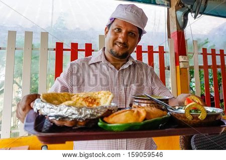 Indian chef serving food on Sony a6300 29, 9 fps HD