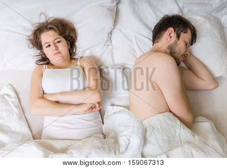 Impotence Concept. Young Man Is Sleeping In Bed. Sad, Disappoint