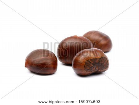 Fresh brown chestnuts isolated on white background