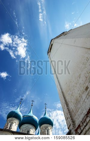 Gorokhovets Vladimir region. A belltower and domes of Annunciation Cathedral against the background of the blue sky
