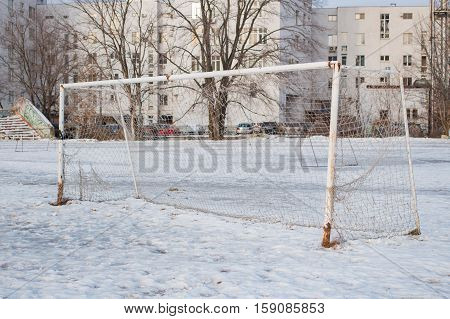 Soccer goal in the winter in the city in the daytime
