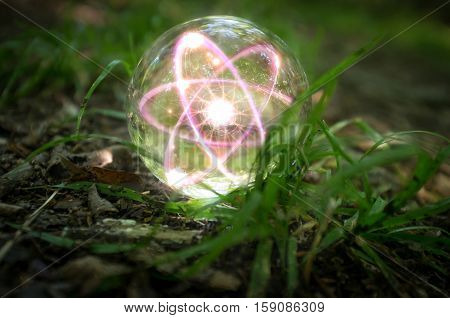 Magic crystal ball atom on forest floor for summer fantasy imagery