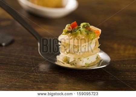 Thousand Leaves Stuffed With Cod Vinaigrette And Heart Of Palm In A Spoon. Taste Gastronomy Finger F