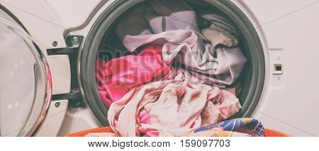 Laundry. Washing clothes in a washing machine at home