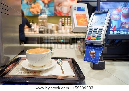 HONG KONG - CIRCA NOVEMBER, 2016: flat white at a McCafe in Hong Kong. McCafe is a coffee-house-style food and drink chain, owned by McDonald's.