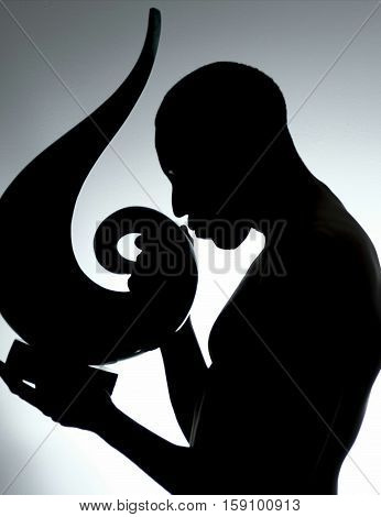Contrast of lights and shadow on a male body