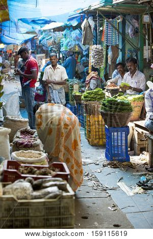 Illustrative image. Pondicherry Tamil Nadu India. February 24 2014. Market place with a lot of shops and people buying selling varieted products