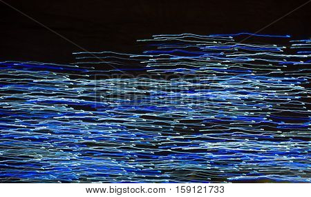 Abstract background made of Christmas lights with long exposure.