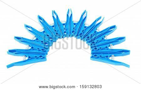 Semicirle shape of blue plastic cloth pegs isolated over white background