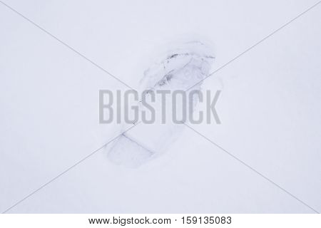 Human footprints in the snow. The path in the snow.