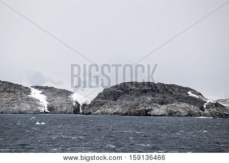 Antarctica in a cloudy day- Antarctic Peninsula - Palmer Archipelago - Neumayer Channel - Global warming - Fairytale landscape