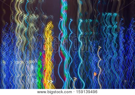 Abstract background made of Christmas lights with long exposure.