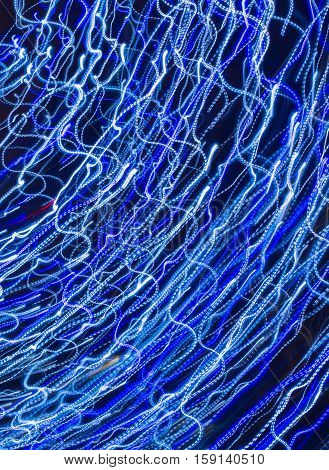 Abstract background made of Christmas lights with long exposure.