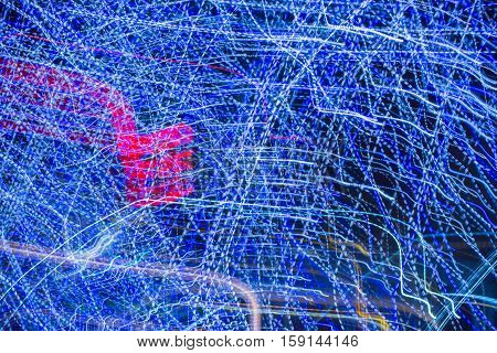 Abstract background made of Christmas lights with long exposure.