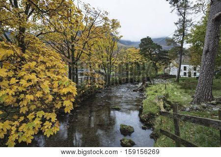 Beautiful Autumn Fall Landscape Image Of Lake Buttermere In Lake District England