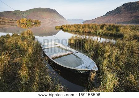 Beautiful Autumn Fall Landscape Image Of Crummock Water At Sunrise In Lake District England