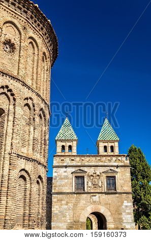 Santiago del Arrabal Church and Puerta de Bisagra Nueva Gate in Toledo - Spain