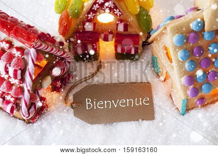 Label With French Text Bienvenue Means Welcome. Colorful Gingerbread House On Snow And Snowflakes. Christmas Card For Seasons Greetings