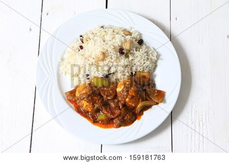 Anda or Egg curry served with roti chapati pualo pilaf rice.