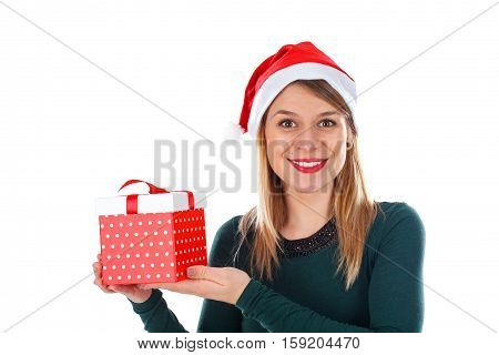 Portait of a happy young woman wearing Santa's hat holding a Christmas gift