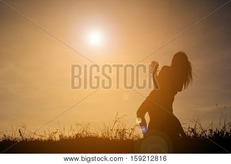 Silhouette happy girl playing guitar at the sky sunset happy time in holiday vintage tone