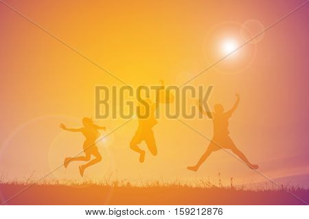 Silhouette of people playing guitar at the sky sunset happy time in holiday vintage tone