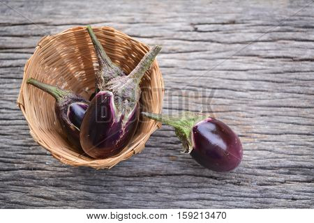 Group of eggplant on old wood background