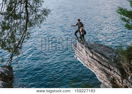 Man And Women Using Phone In Mountain In Montenegro, Freedom And Travel Cocept