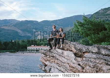 Young Man And Women Freelancers With A Laptop And Phone In  Mountain In Montenegro, Freedom And Trav