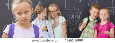 Sad School Girl And Children Laughing And Backbiting Her