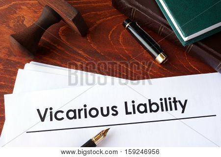 Papers with title Vicarious Liability on a table.