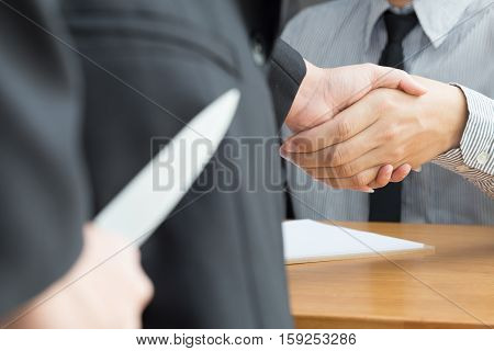 Blackmail concept Business handshake and doing agreement