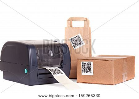 Barcode printer and packaging boxes marked with a bar code.Dummy barcode contains text 