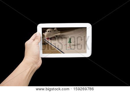 hand holding tablet with calendar of christmas on december 2016 image on black backgroundconcept for count down or new yeaer