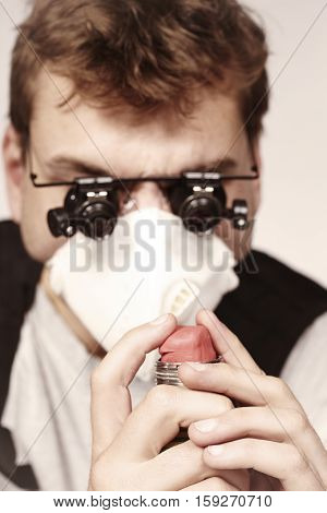Man making classic type of tube bomb at home