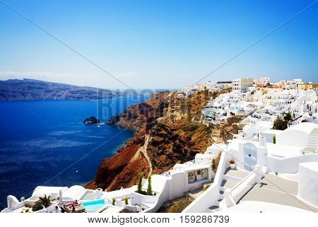 Oia, traditional greek village and Aegan sea waters, Santorini, Greece, retro toned