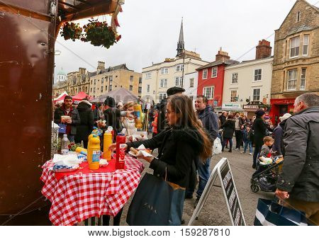 Broad Street Oxford UK 27th November 2016: The Real German Sausage stall with ketchup and senf table on Oxford's Christmas Light Festival