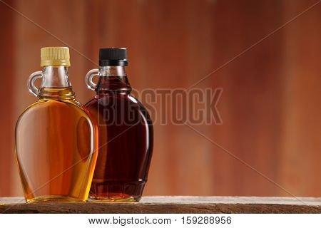 bottle of syrup on the wooden background