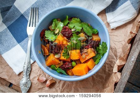 Vegan garnish. Boiled sweet potatoes with green peas cilantro and linseed oil. Perfect for the detox diet or just a healthy meal. Love for a healthy raw food concept.