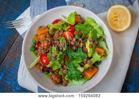Salad with baked sweet potatoes avocados lentils dried tomatoes cilantro pumpkin seeds and oil. . Perfect for the detox diet or just a healthy meal. Love for a healthy raw food concept.