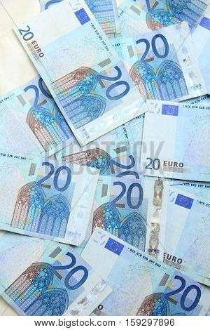 Twenty euro notes spead over a table