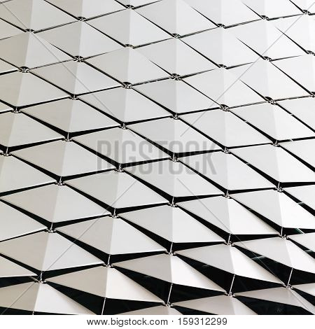 Abstract close-up view of modern aluminum ventilated triangles on facade