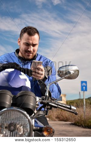 Biker Talking By Phone With His Smarth Phone